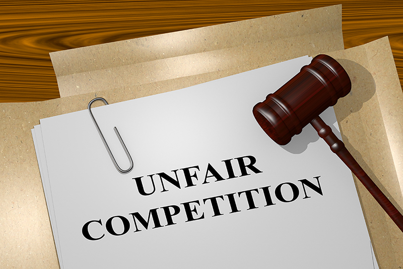 Picture of  'UNFAIR COMPETITION' title written on legal documents